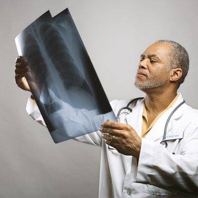 Healthcare worker looking at x-ray