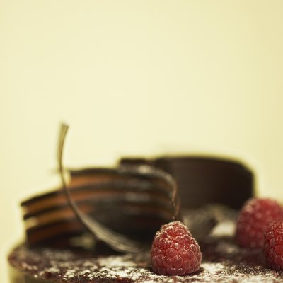 Chocolate ganache cake with raspberries and chocolate shavings