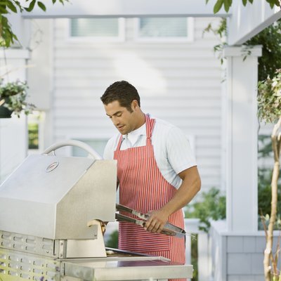 Hispanic man next to barbecue
