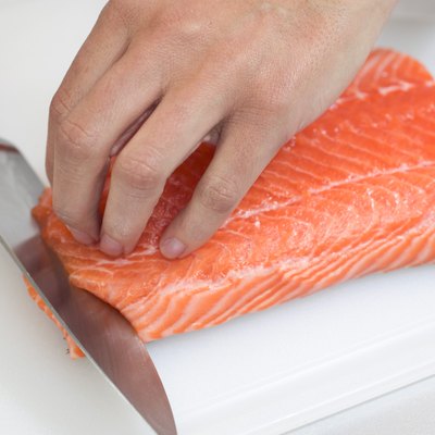 Chef slicing sushi