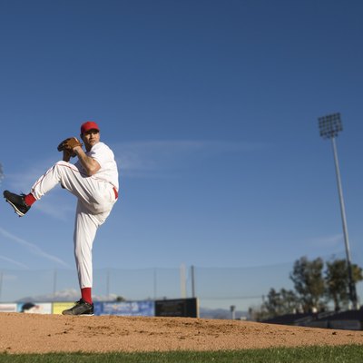 USA, California, San Bernardino, baseball pitcher throwing pitch, outdoors
