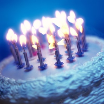 tungsten toned close-up of an array of candles on a birthday cake