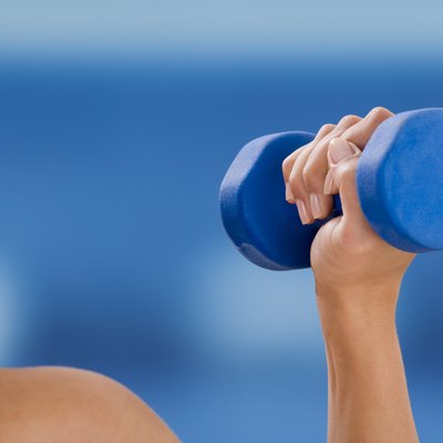 Woman holding dumbbell