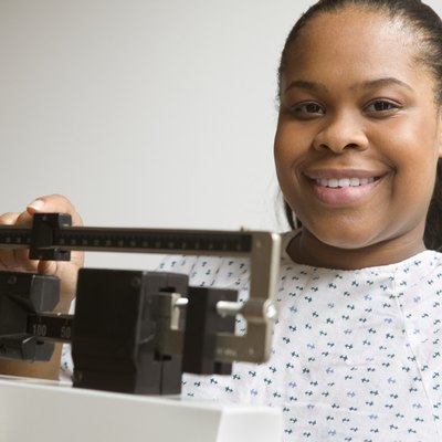 African American woman weighing herself
