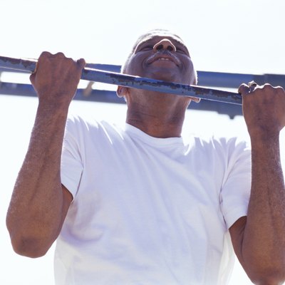 Senior man doing a chin-up