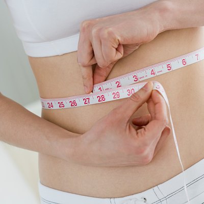 Woman measuring waist