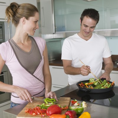 Couple cooking in kitchen