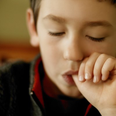 Young boy fallen asleep while sucking thumb