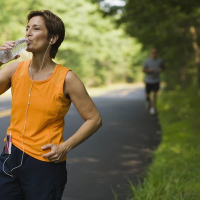 Jogger drinking bottled water