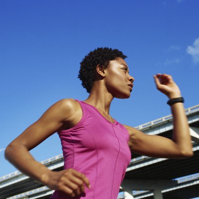 Low angle view of a young woman jogging