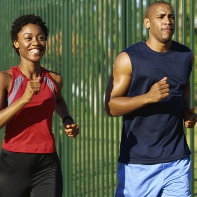 Close-up of two young people jogging