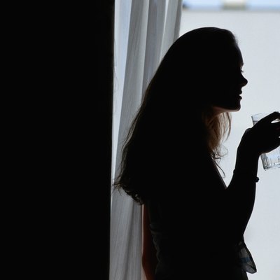 Woman with glass of water