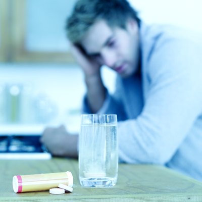 close-up of alkalisers immersed into a glass of water