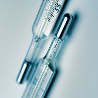Two glass thermometers, close-up