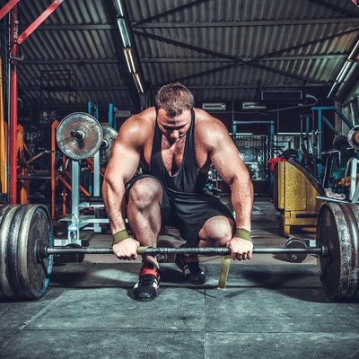 Powerlifter with strong arms lifting weights