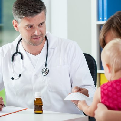Pediatrician giving prescription