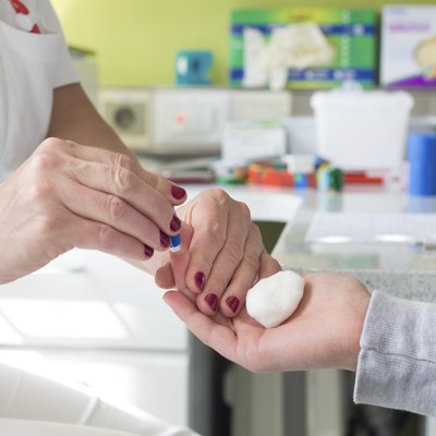 Blood type testing by prick test.