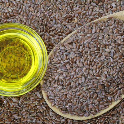 Cold pressed Linseed yellow oil on flax seeds