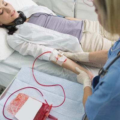 Nurse removing the transfusion