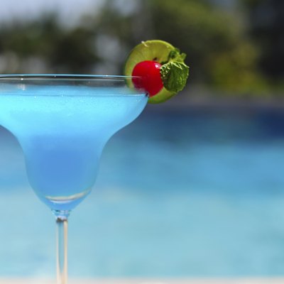 Blue cocktail on swimming pool side