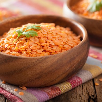 raw healthy red lentils in bowl