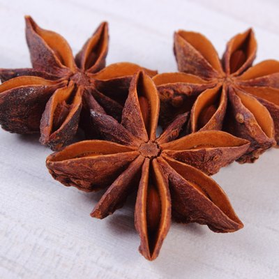 Star anise spice on white wooden table