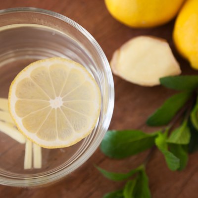 Lemon Ginger Tea with wooden Background