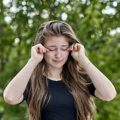 Sleepy Woman rubbing her Eyes