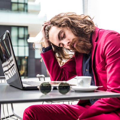 Hipster man working at computer