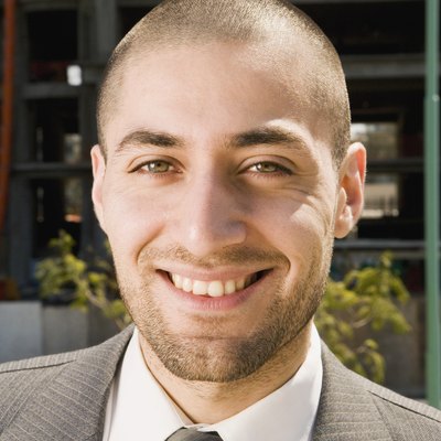 Close up of Hispanic businessman smiling