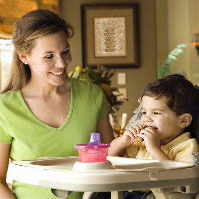 Mother feeding her son