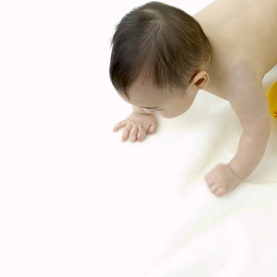 a toddling baby and a toy