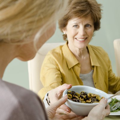 Women passing food