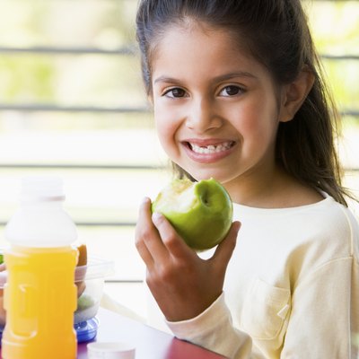 Girl eating lunch at kindergarten