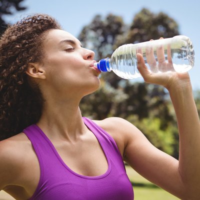 Fit woman taking a drink