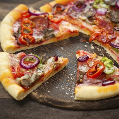 Pizza with ham, mushrooms and cheese