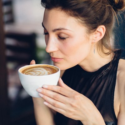 Pretty woman drinking coffee