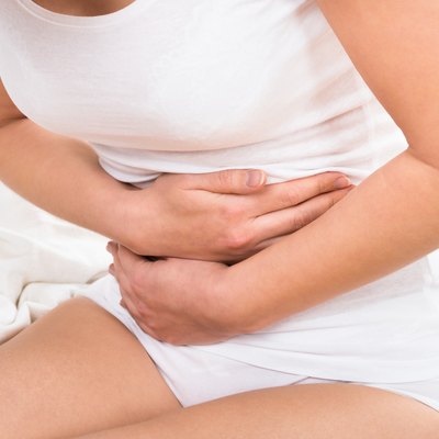 Woman Suffering From Stomach Ache