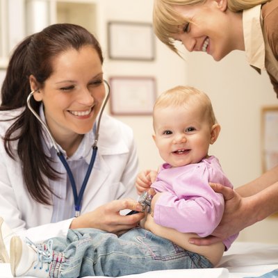 Pediatrician examine baby with stethoscope