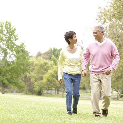 Senior Couple Walking In Park