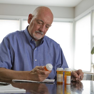 Older man with prescription medications