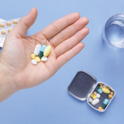 Pills and capsule on hand