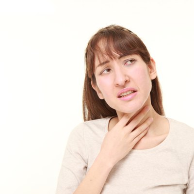 young woman having throat pain