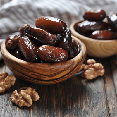 Dates fruit in a wooden bowl