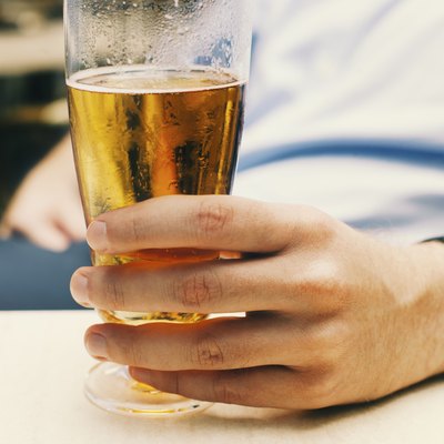 Man holding a glass of beer