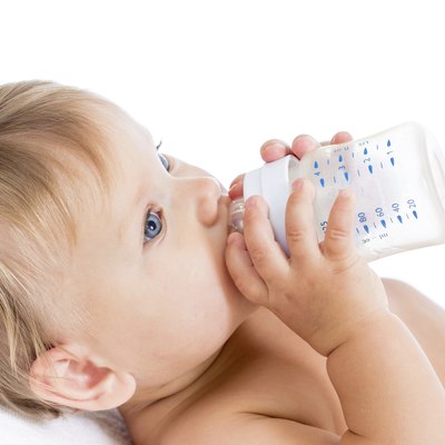 adorable child drinking from bottle
