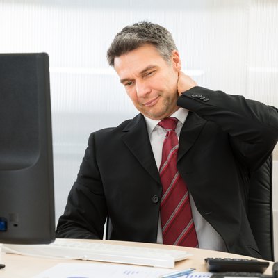 Businessman Suffering From Neck Pain