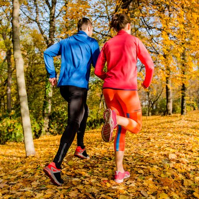 Couple jogging in autumn nature