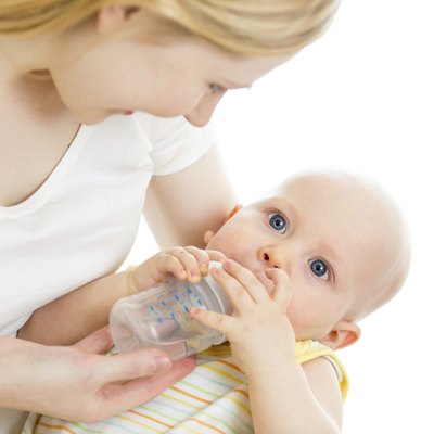 mother feeding his baby infant from bottle