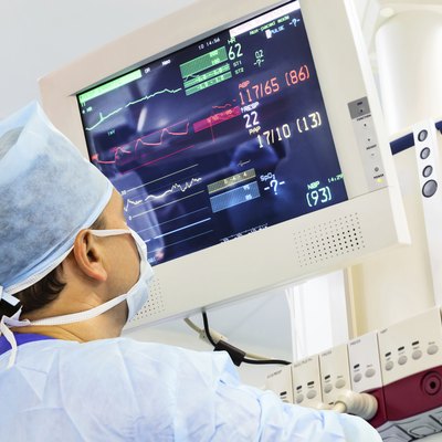 Male anaesthesiologist with monitor